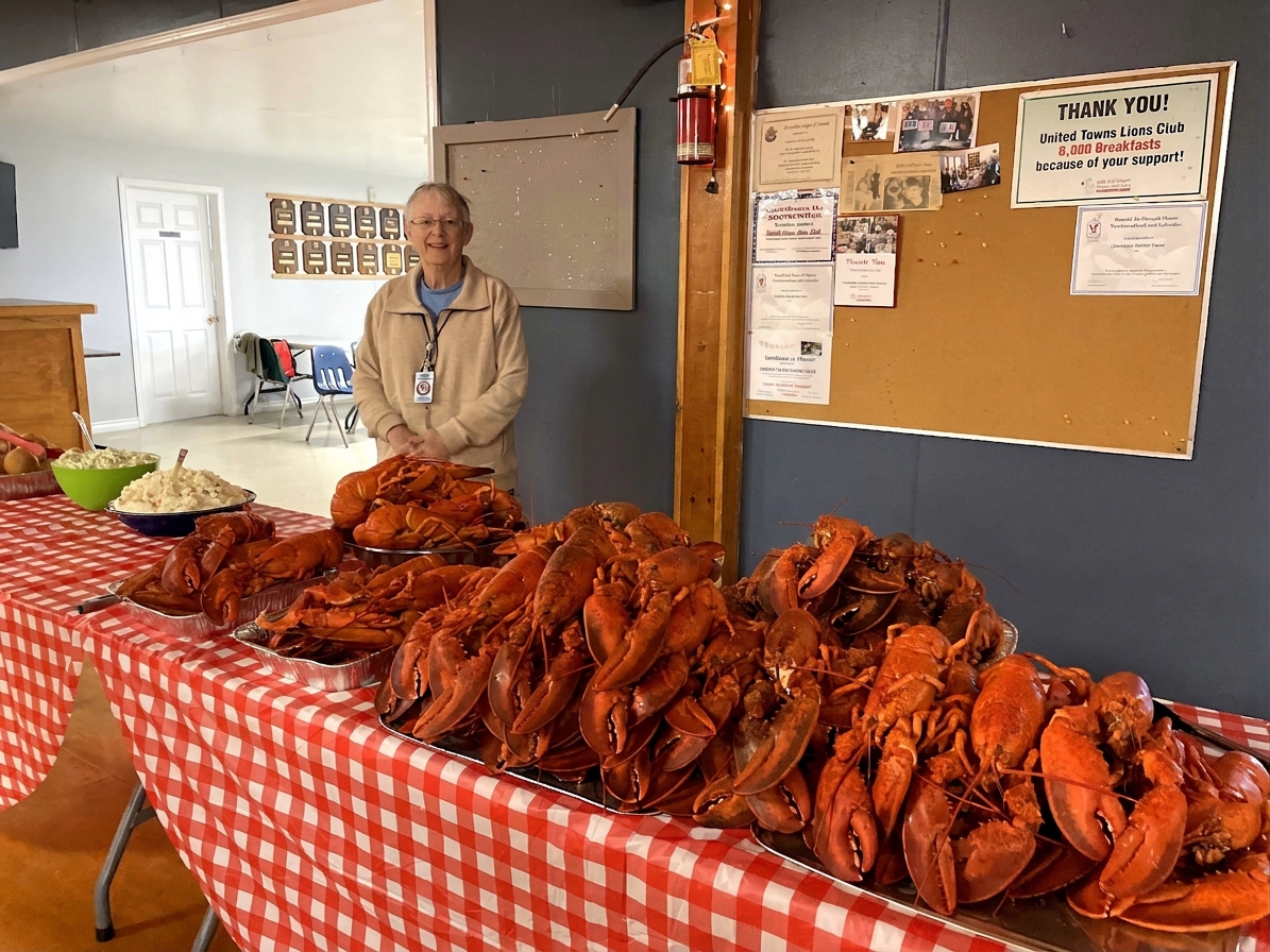 A table piled high with fresh-cooked lobster